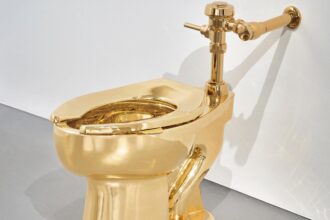 A solid gold toilet is up for auction with a $10 million starting price