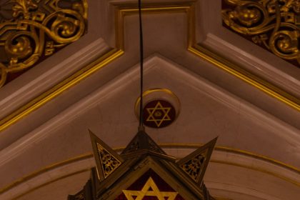 Suspect in Michigan synagogue attack is dead, AP source says