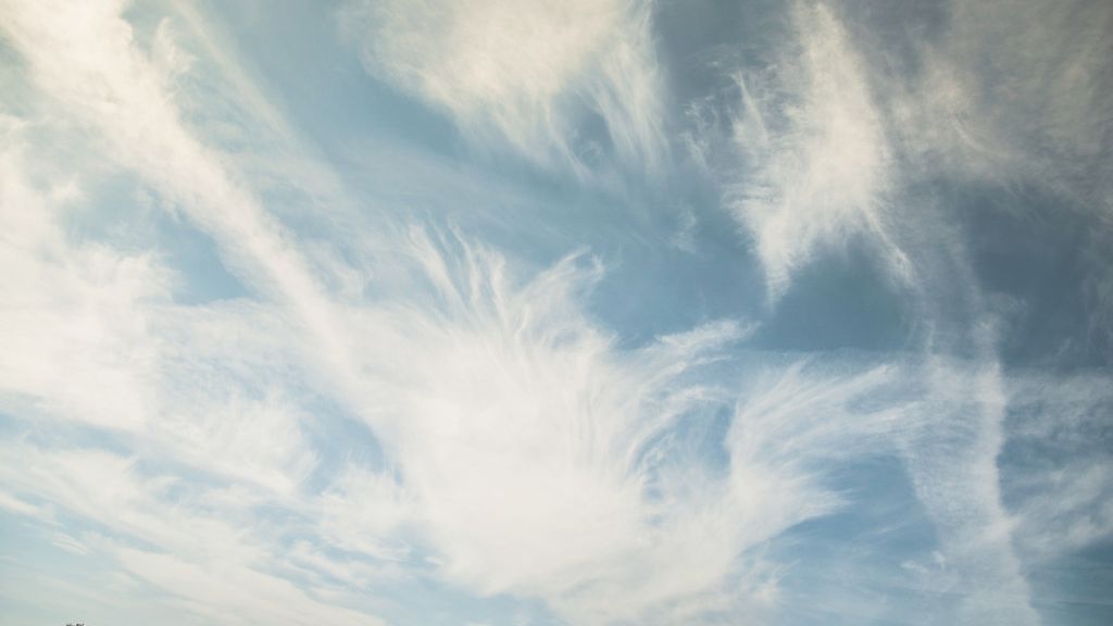 Cool feel to end the week, spotty light showers possible into Saturday