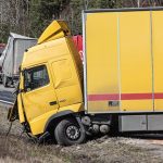 Driver pinned after semi-truck overturns in central Las Vegas