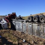 2 survive after overturned big rig crushes their car on 91 Freeway in Orange County