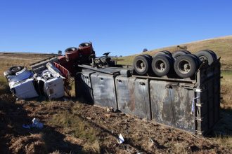 2 survive after overturned big rig crushes their car on 91 Freeway in Orange County
