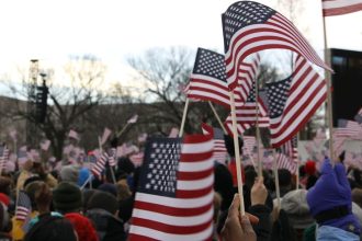 Trump Basks as Hundreds of Chanting Children Wave Flags at China Arrival Ceremony