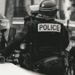 Suspect in police shooting on high school campus arrested, identified